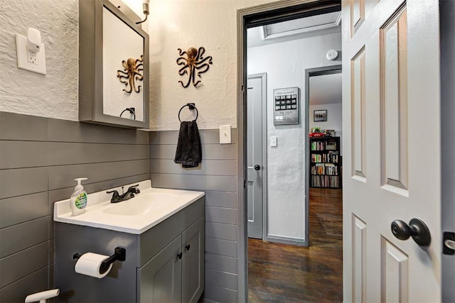 bathroom with vanity and hardwood / wood-style floors