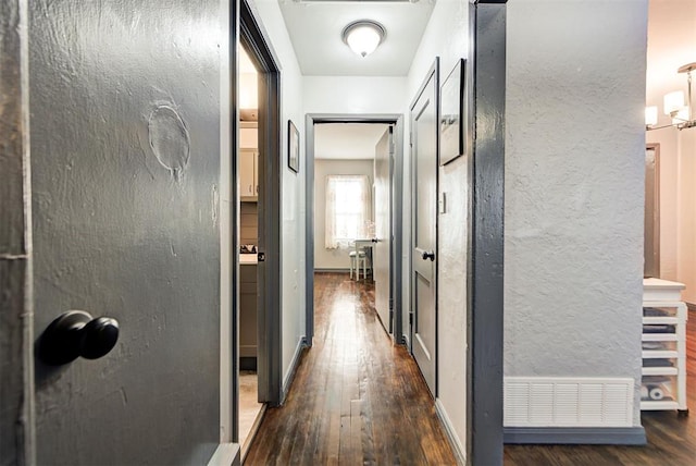 hallway featuring dark hardwood / wood-style floors