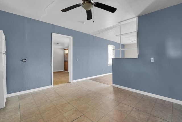 spare room featuring ceiling fan