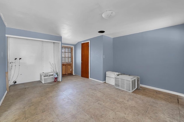 empty room featuring an AC wall unit