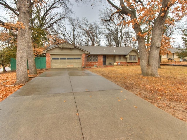 ranch-style home featuring a garage