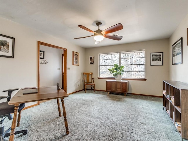 office area with carpet floors and ceiling fan