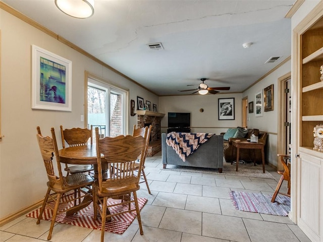 dining space featuring ornamental molding, ceiling fan, and light tile patterned flooring