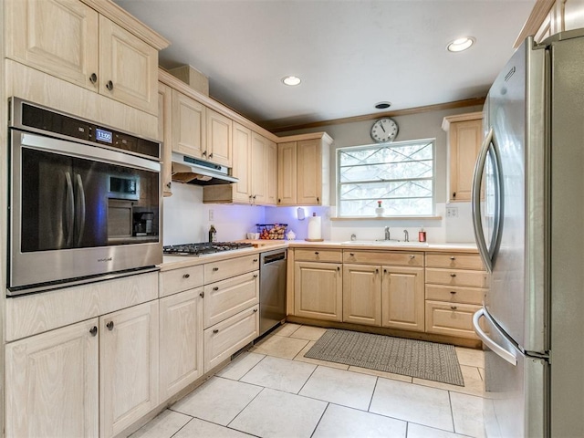 kitchen featuring sink, crown molding, stainless steel appliances, light tile patterned flooring, and light brown cabinetry