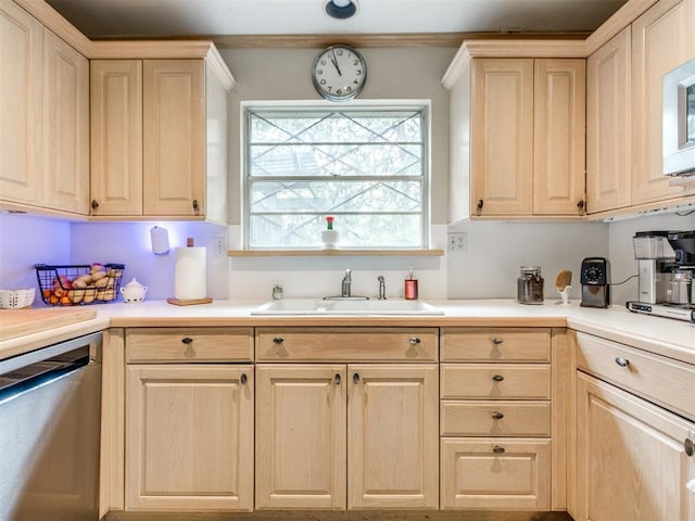 kitchen featuring dishwasher, sink, and light brown cabinets