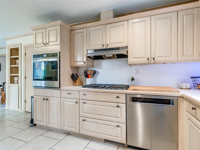 kitchen featuring appliances with stainless steel finishes and light tile patterned floors