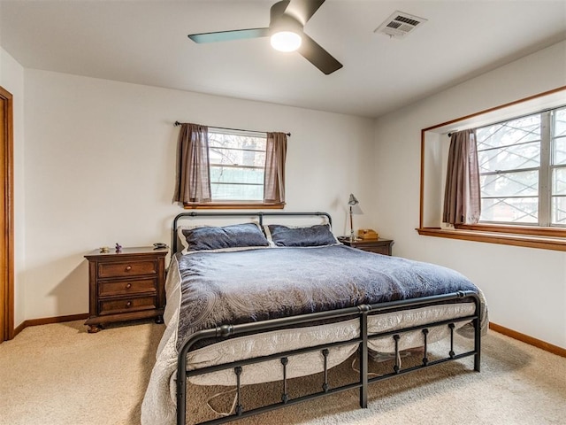 bedroom featuring ceiling fan and light colored carpet