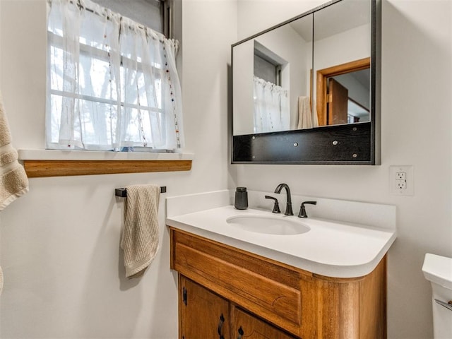 bathroom with vanity and toilet