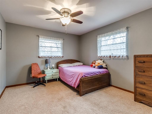 bedroom with light colored carpet and ceiling fan