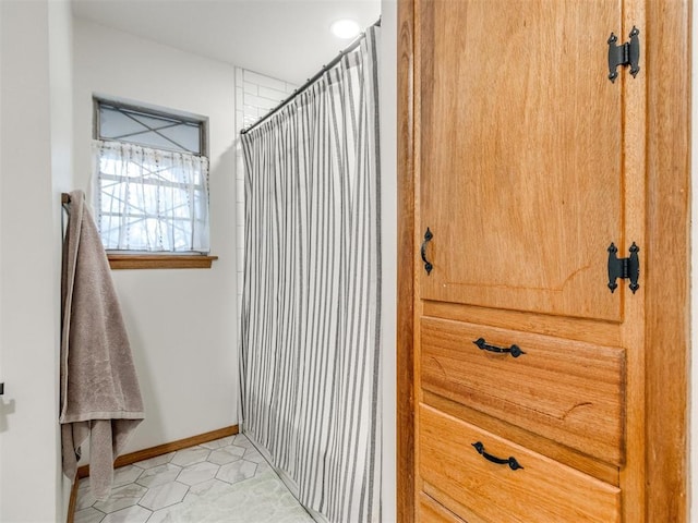 bathroom featuring tile patterned flooring and walk in shower