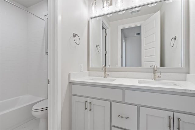 full bathroom featuring marble finish floor, visible vents, a sink, and shower / bathing tub combination