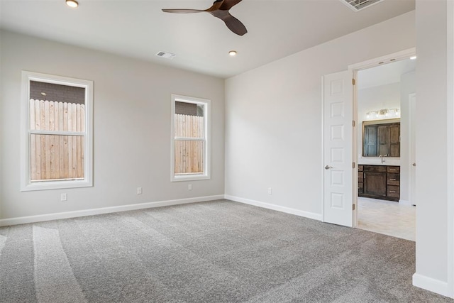 unfurnished room featuring recessed lighting, visible vents, a ceiling fan, light carpet, and baseboards