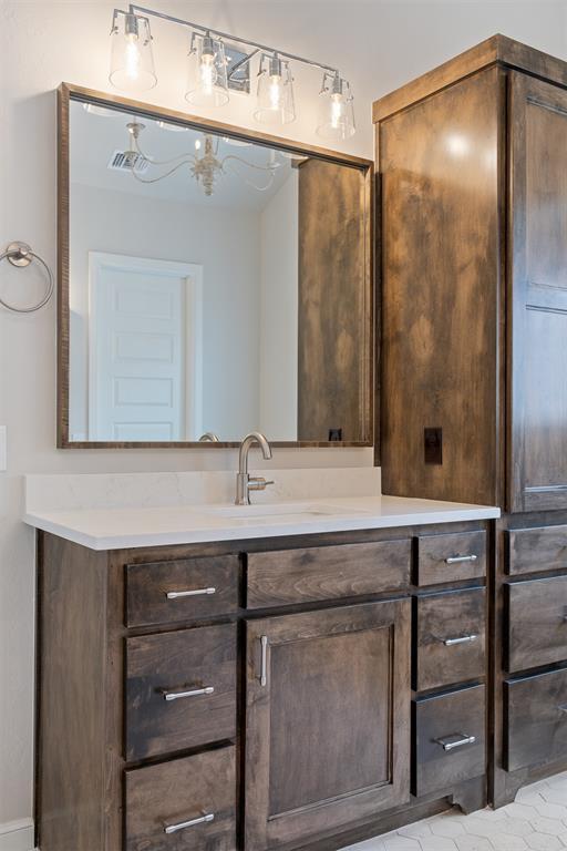 bathroom featuring visible vents and vanity