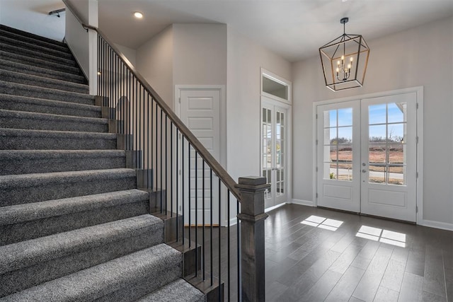 entryway with french doors, recessed lighting, stairway, dark wood-type flooring, and baseboards