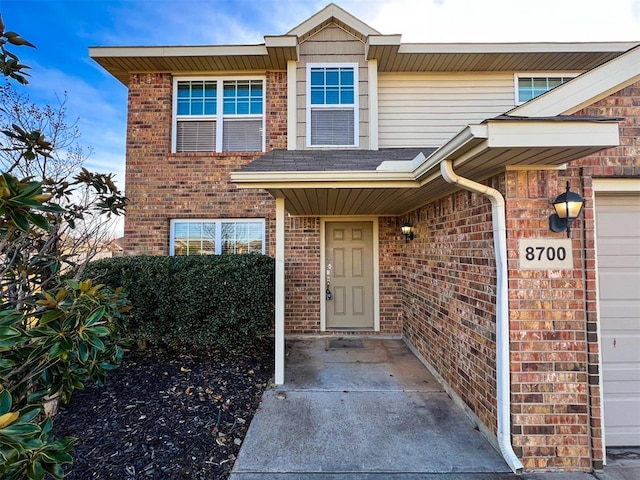 property entrance with a garage