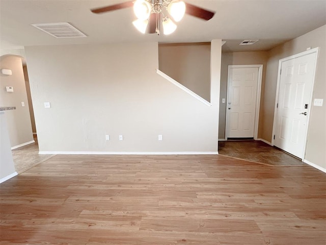 spare room featuring ceiling fan and light hardwood / wood-style flooring