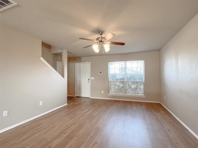 spare room with ceiling fan and light hardwood / wood-style floors