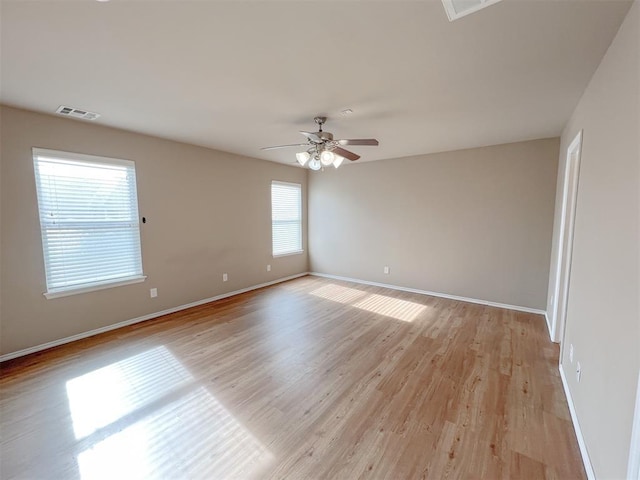 spare room with ceiling fan and light hardwood / wood-style floors