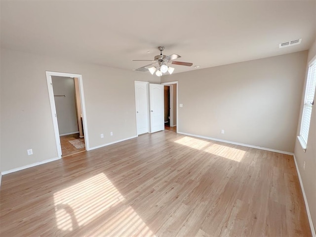 spare room featuring ceiling fan and light hardwood / wood-style floors