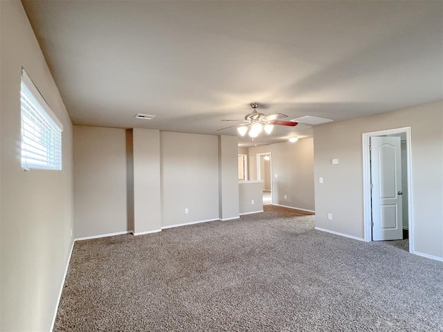 empty room with ceiling fan and carpet flooring