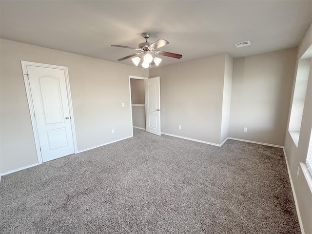 unfurnished bedroom with carpet floors and ceiling fan