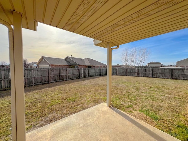 yard at dusk with a patio area