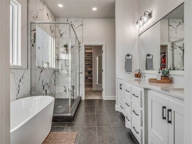 bathroom featuring vanity, separate shower and tub, and tile patterned flooring