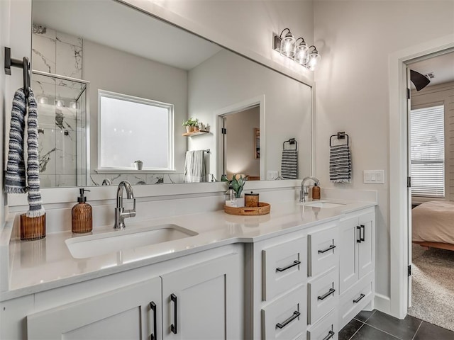 bathroom featuring vanity, an enclosed shower, and tile patterned floors