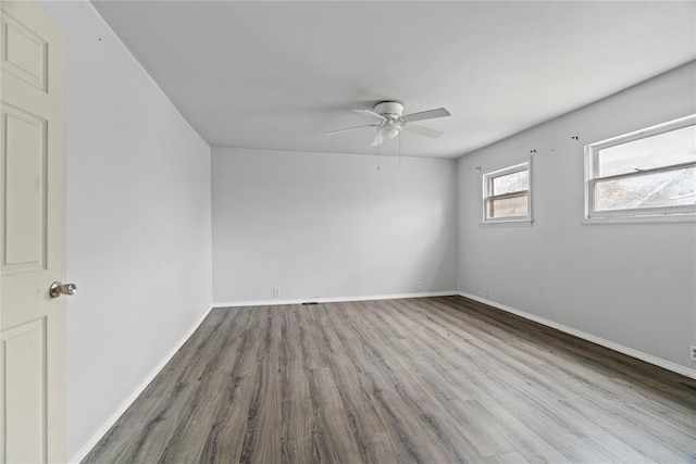 unfurnished room featuring ceiling fan and light wood-type flooring