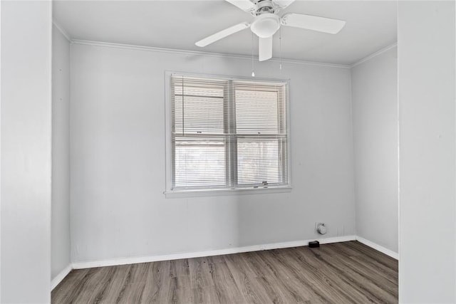 spare room featuring ornamental molding, hardwood / wood-style floors, and ceiling fan
