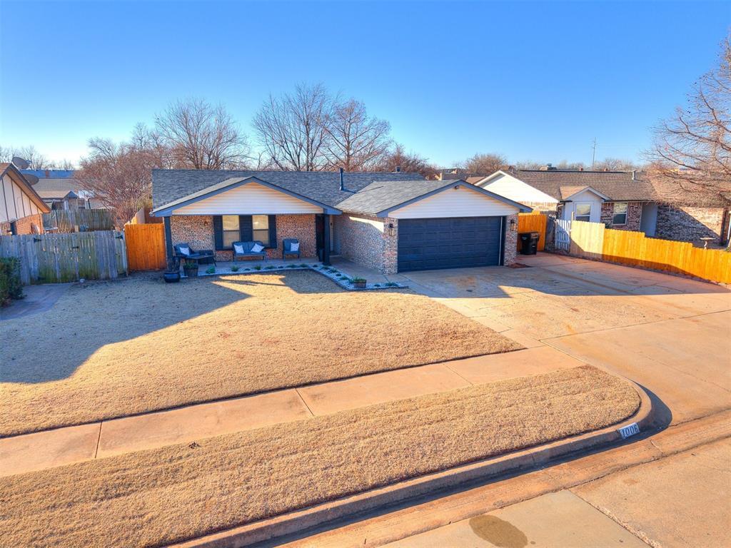 ranch-style house featuring a garage