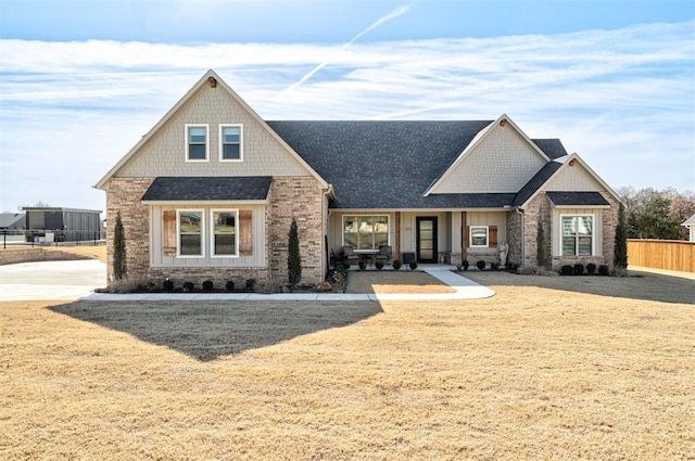 craftsman house with a front lawn