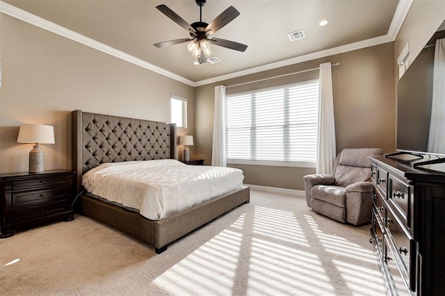 carpeted bedroom featuring crown molding and ceiling fan