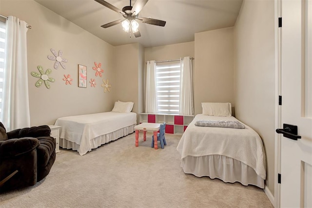 bedroom with ceiling fan and carpet flooring