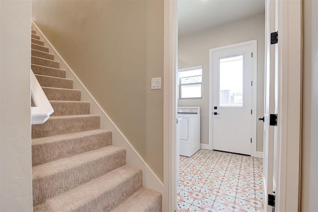 entryway featuring washer / dryer