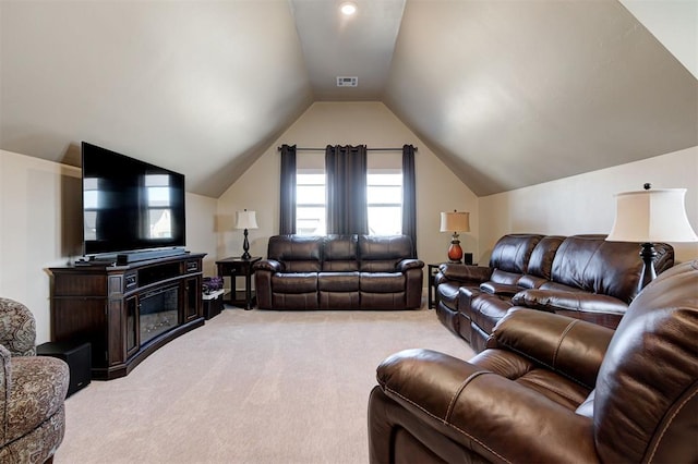 living room with lofted ceiling and light colored carpet