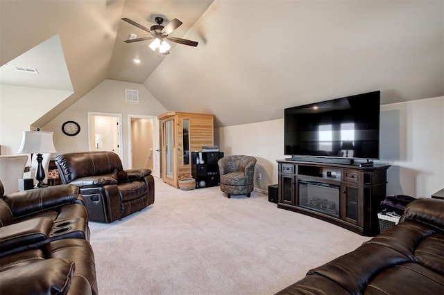 carpeted living room featuring vaulted ceiling and ceiling fan