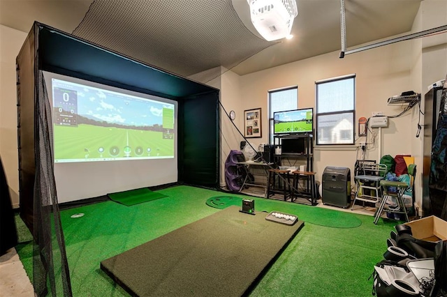 playroom featuring golf simulator and carpet flooring