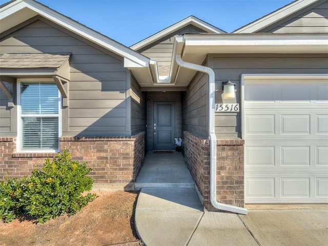 property entrance with a garage