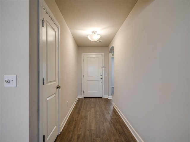 hallway featuring dark hardwood / wood-style floors