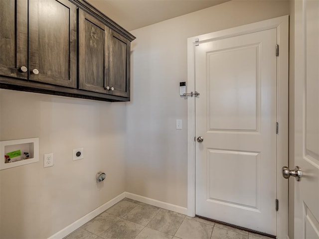 clothes washing area with electric dryer hookup, hookup for a washing machine, and cabinets