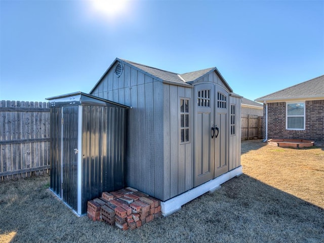 view of outbuilding featuring a yard