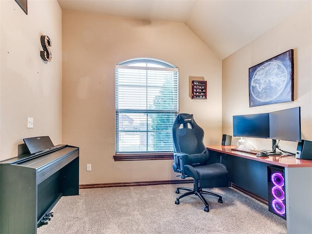 office area featuring lofted ceiling and light carpet