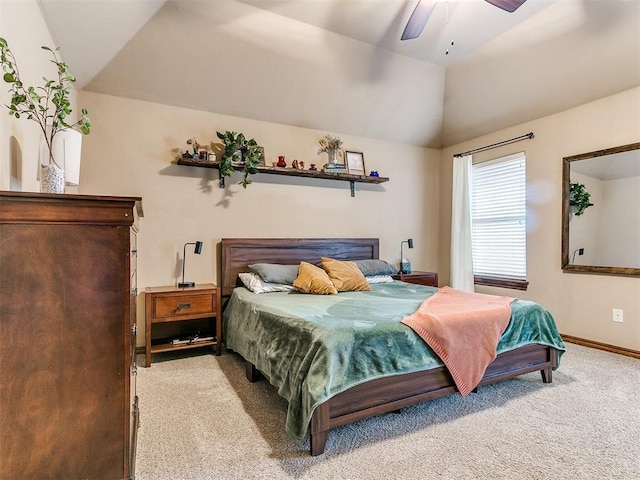 carpeted bedroom featuring lofted ceiling and ceiling fan