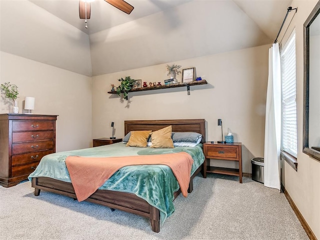 carpeted bedroom featuring vaulted ceiling and ceiling fan