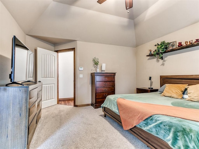 carpeted bedroom with vaulted ceiling and ceiling fan