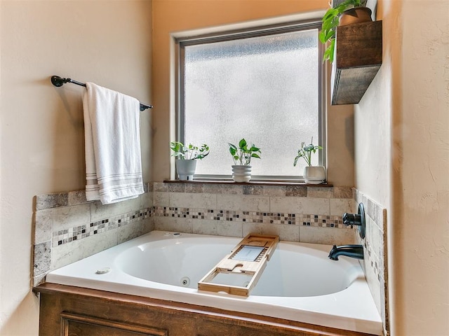 bathroom with tiled bath