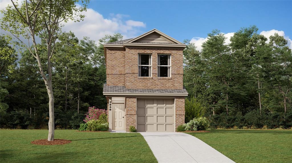 view of front of property with a garage and a front yard