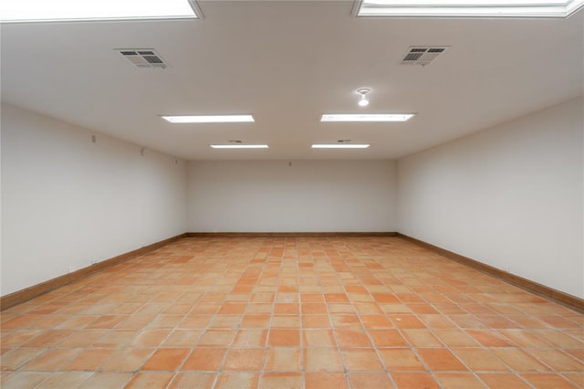 unfurnished room with light tile patterned floors