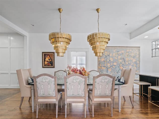 dining room featuring a notable chandelier and hardwood / wood-style floors